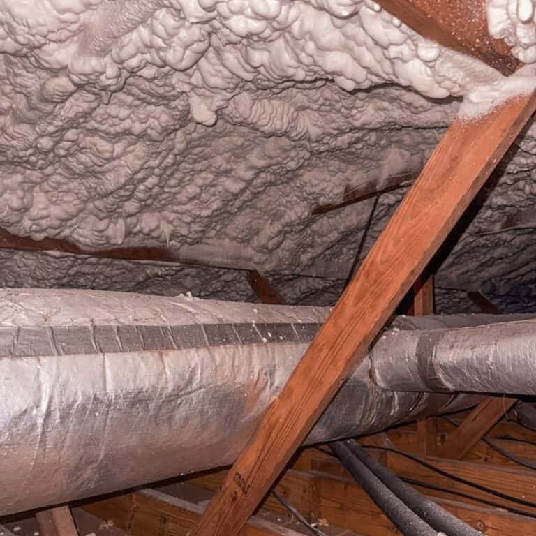 Spray foam roof deck above insulated AC ductwork in an attic