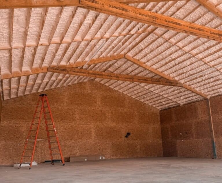 Large building with spray foam insulation on the underside of the roof