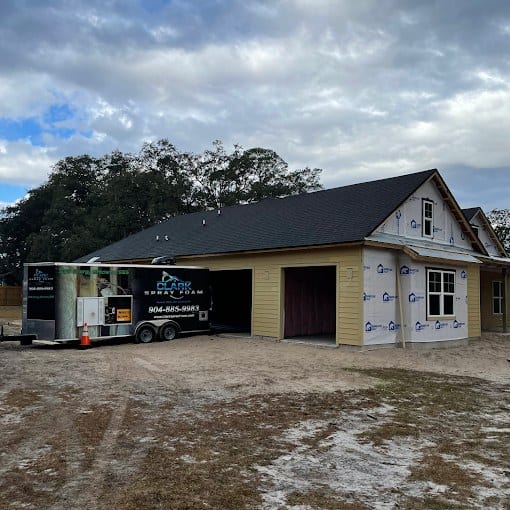 New construction home with the Clark Spray Foam trailer on site