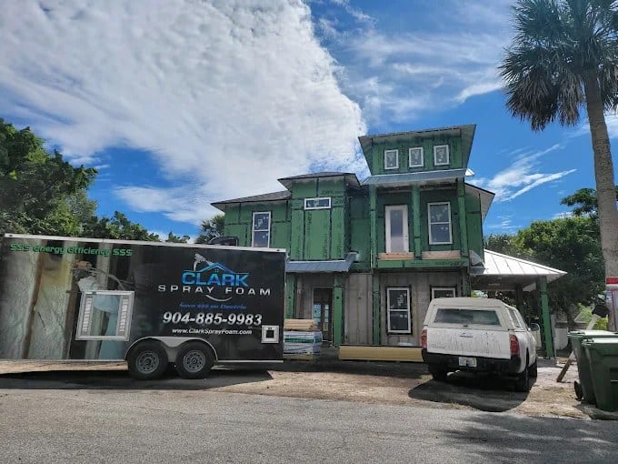 Multi-story new construction home with the Clark Spray Foam trailer on site